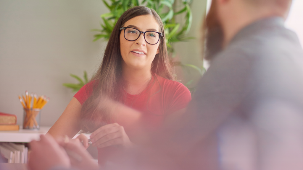 An image of a mediator discussing Legal Aid with a client.