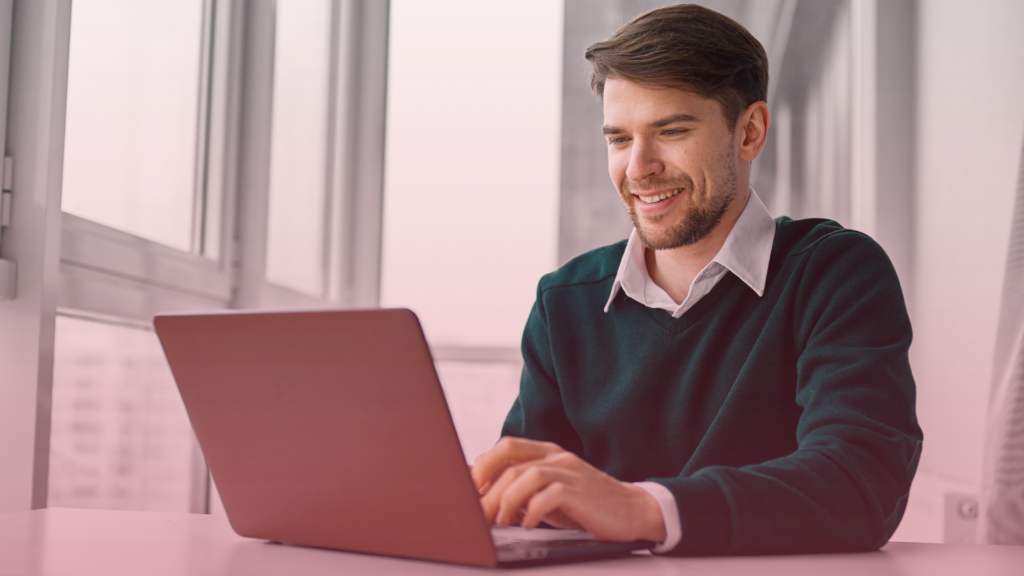 A man attending an online MIAM meeting on his laptop.